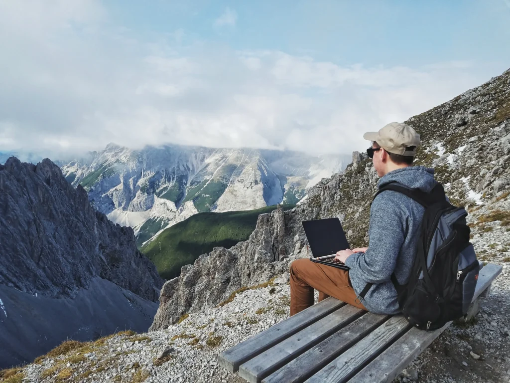 A product designer named Danny Sapio works on a laptop with design tools on the screen, showcasing a workspace enhanced by Framer.